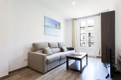 a living room with a couch and a table at 2513 - AB Comte dUrgell II-I in Barcelona