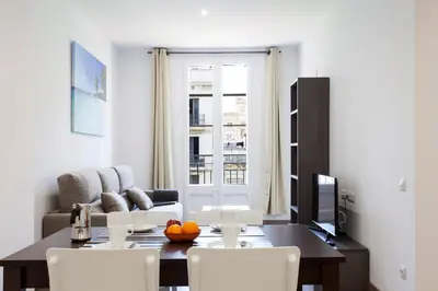 a living room with a table and a couch at 2513 - AB Comte dUrgell II-I in Barcelona