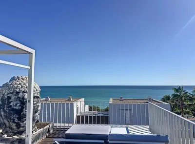 a view of the ocean from the balcony of a house at Duplex vistas mar con piscina in Sant Pere de Ribes