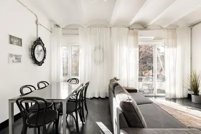 a dining room with a table and chairs at Eulalias Lodges Barcelona in Barcelona