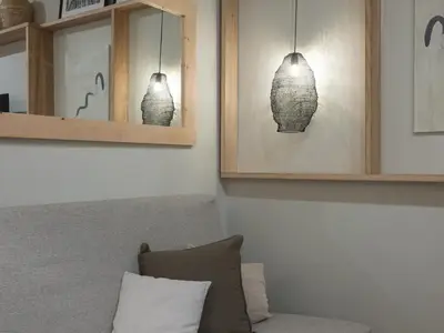 a living room with two vases on the wall at ´Vicens Gem´ Private terrace HS Wi-Fi in Gracia by MyRentalHost in Barcelona
