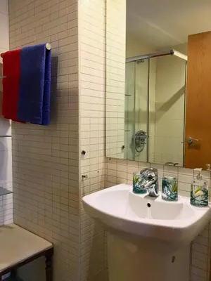 a bathroom with a sink and a mirror at Apartment familiar in Barcelona