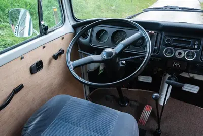 a dashboard of a car with a steering wheel at Retro VW Kombi T2 Campervan in Hospitalet de Llobregat