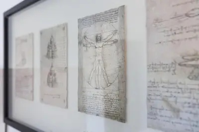 a framed picture of a cross on a book at Housalia Casa del Mar en Vila Olímpica in Barcelona