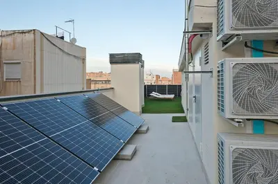 a rooftop with a solar array on a building at YOUR HOME- Apartment Camp Nou 2a in Hospitalet de Llobregat