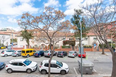 a bunch of cars parked in a parking lot at La Sagrera House in Barcelona
