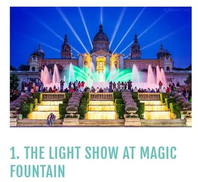 a light show at magic fountain in front of a building at Cozy and sunny penthouse Fira BCN in Hospitalet de Llobregat