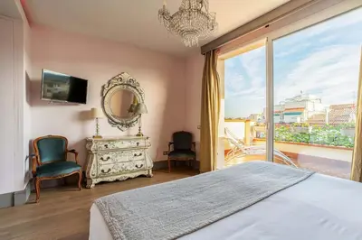 a bedroom with a bed and a large window at Canela Homes BARCELONA SEPULVEDA in Barcelona