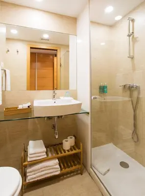 a bathroom with a sink and a shower at Durlet Rambla Mar Apartments in Barcelona
