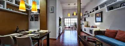 a living room with a table and a couch at Holiday home La casa azul in Barcelona