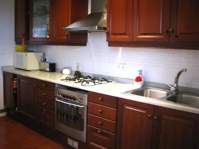 a kitchen with a sink and a stove top oven at Holiday home La casa azul in Barcelona