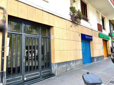 a building with a door on the side of a street at Apartment carrer d'Olesa in Barcelona