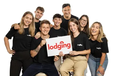 a group of people wearing black shirts holding a sign at Lodging Apartments Almirall Beach 41 in Barcelona