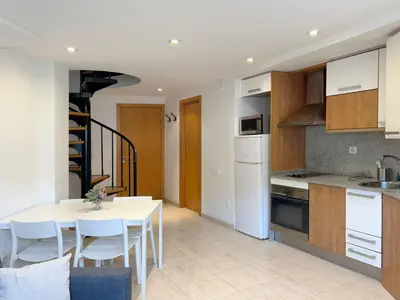 a kitchen and dining room with a table and chairs at M3 Céntrico y con Terraza in Terrassa
