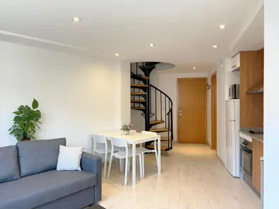 a living room with a couch and a table at M3 Céntrico y con Terraza in Terrassa