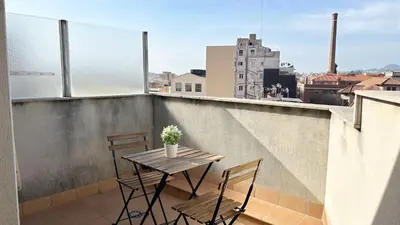 a table and chairs on a balcony with a view at M3 Céntrico y con Terraza in Terrassa