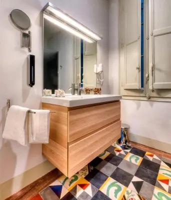 a quotationatory logo with a magnifying glass at The Collection Barcelona - Paseo de Gracia Catalan 4BD with private Terrace in Barcelona