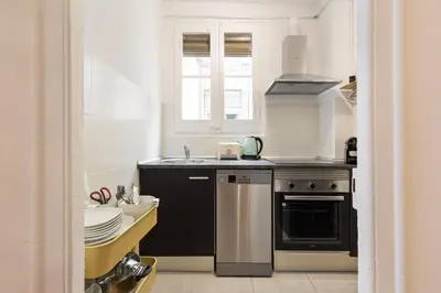 a kitchen with a stove and a sink at Sagrada Familia Vl by Enjoy Apartments in Barcelona