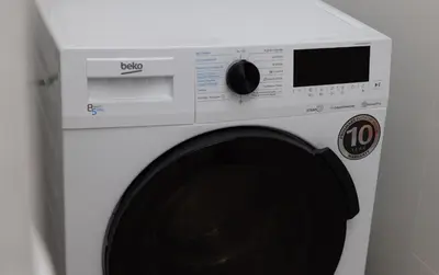 a white washing machine sitting in a room at Stay U-nique Apartments Balmes II in Barcelona