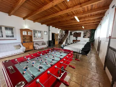 a room with a table with a game of chess at VILLA MasÍa CAL TONI in Pineda de Mar