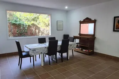 a kitchen with green and white counter tops at Villa Apartment with Pool and Amazing Views! in Arenys de Mar