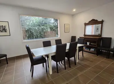 a living room with a couch and a coffee table at Villa Apartment with Pool and Amazing Views! in Arenys de Mar