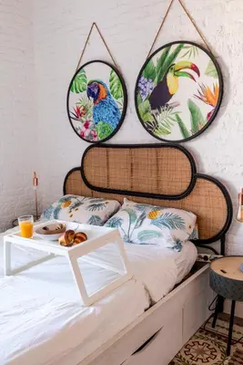 a bedroom with a bed with two mirrors on the wall at Enchanting 2 BR flat with terrace near Plaça Espanya in Barcelona
