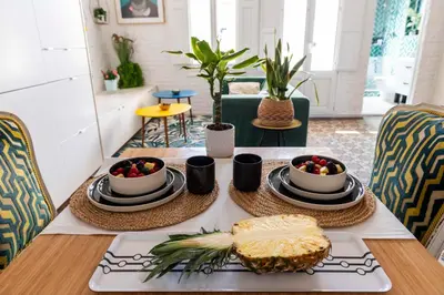 a table with a tray of food on a table at Enchanting 2 BR flat with terrace near Plaça Espanya in Barcelona
