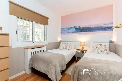 a bedroom with a bed and a window at Beautiful Villa Encanto with private pool in Olivella