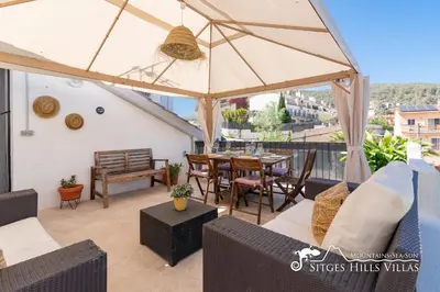 a bedroom with a wall mural of a beach at Beautiful Villa Encanto with private pool in Olivella
