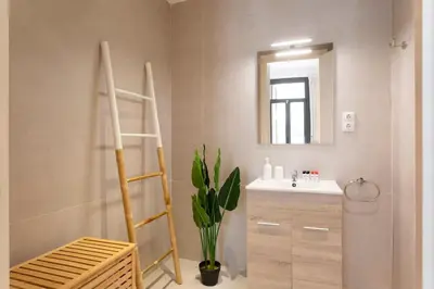 a bathroom with a sink and a mirror at Lodging Apartments Rambla Poblenou 12 in Barcelona