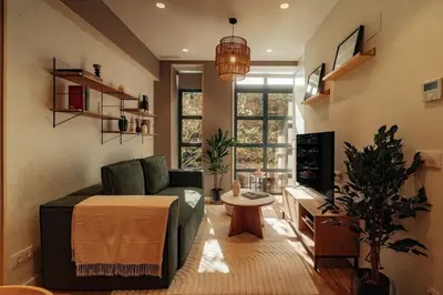 a living room with a couch and a table at Casa Macaya - 1b apartment in Eixample in Barcelona