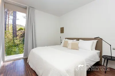 a bathroom with two sinks and a tub and a mirror at Stunning Villa Angeles with Private Pool and AC close to Sitges in Olivella