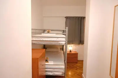 a small bathroom with a toilet and a shower at Homenfun Barcelona Eixample ll in Barcelona