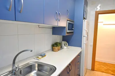 a small room with a bunk bed and a desk at Homenfun Barcelona Eixample ll in Barcelona