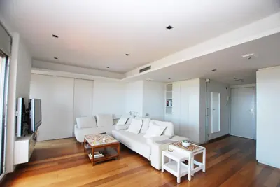 a living room with a white couch and a table at Picasso Street in Vilassar de Mar