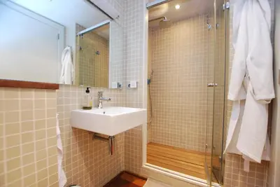 a bathroom with a sink and a shower at Picasso Street in Vilassar de Mar