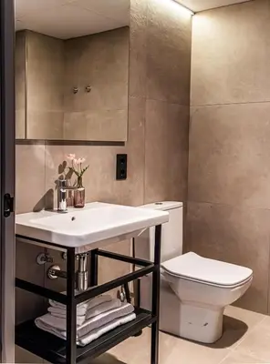 a bathroom with a sink and a toilet at Atenea Living in Mataró