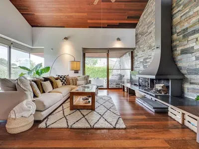 a living room with a couch and a fireplace at Xauxa in Sant Pere de Vilamajor