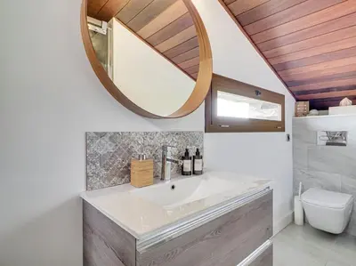 a bathroom with a sink and a mirror at Xauxa in Sant Pere de Vilamajor