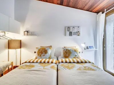 a bedroom with a bed and a window at Xauxa in Sant Pere de Vilamajor