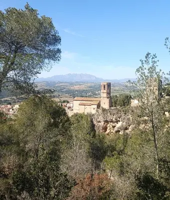 a building on top of a hill with trees at Apartamento Gerimar - Gelida/Bcn in Gélida