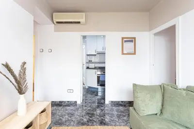 a living room with a couch and a table at 3 Bdr Apt In Cornella 5 Mins Form The Metro in Cornellà de Llobregat