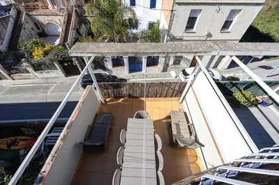 an overhead view of a balcony with chairs and tables at House 5 Mins From Montgat Beach in Montgat