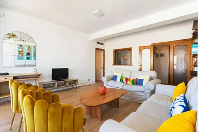 a living room with a couch and a table at Sunny 3BR2BA w Private Terrace AC in Barcelona