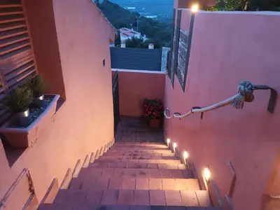 a set of stairs leading up to a house at vistas y relax 126m privados con piscina No cocina in Costa del Maresme