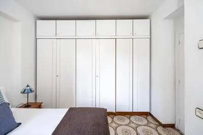 a bedroom with a large white closet at 2 Bdr Apt In Cornella 5 Mins Form The Metro in Cornellà de Llobregat