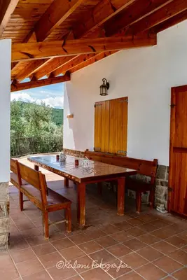 a ping pong table on the patio of a house at Ca L’Oscana in Bigues i Riells