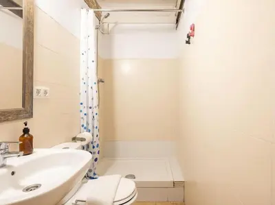 a bathroom with a sink and a toilet and a shower at Las Ramblas, comfort in BCN for 8 persons in Barcelona