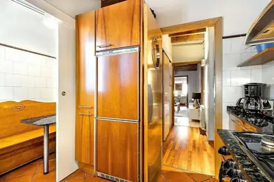 a room with a desk with a mirror and a chair at The Collection Barcelona - Paseo de Gracia sunny 2BR penthouse in Barcelona